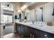 Bright bathroom with double vanity, quartz countertop, and wood-look tile flooring at 30511 N 162Nd Way, Scottsdale, AZ 85262