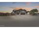 Charming exterior with desert landscaping and a three-car garage, blending seamlessly with the Arizona surroundings at 30511 N 162Nd Way, Scottsdale, AZ 85262