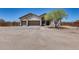 Expansive desert home with three-car garage, stone accents, desert landscaping, and ample parking at 30511 N 162Nd Way, Scottsdale, AZ 85262