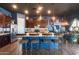 Spacious kitchen featuring an island with seating, stainless steel appliances, and wooden floors at 30511 N 162Nd Way, Scottsdale, AZ 85262