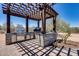 Built-in outdoor kitchen with stainless steel grill and stone counter at 30511 N 162Nd Way, Scottsdale, AZ 85262