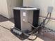 This is a close up of the property's AC unit, sitting outside on a gravel lot at 318 S Crismon Rd # 65, Mesa, AZ 85208