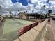 This neighborhood features a community area with a volleyball net and benches at 318 S Crismon Rd # 65, Mesa, AZ 85208