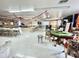 Large community center with game tables, seating, kitchen, and decorative elements at 318 S Crismon Rd # 65, Mesa, AZ 85208