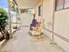 Inviting covered porch with rocking chairs for relaxing outdoors at 318 S Crismon Rd # 65, Mesa, AZ 85208