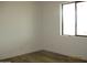 Bright bedroom featuring wood-look floors and a window allowing for ample natural light at 34449 N Elk Run Rd, San Tan Valley, AZ 85143