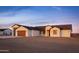 Charming single-story home with neutral colors, multiple car garage, and desert landscaping at 34449 N Elk Run Rd, San Tan Valley, AZ 85143