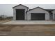 White stucco house with multiple garage spaces and modern architecture at 34449 N Elk Run Rd, San Tan Valley, AZ 85143
