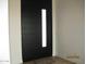 Modern front door with a vertical window pane and sleek design at 34449 N Elk Run Rd, San Tan Valley, AZ 85143