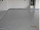 Garage with sealed floor and water heater at 34449 N Elk Run Rd, San Tan Valley, AZ 85143
