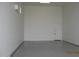 Large garage with sealed concrete floors, bright lighting, and a mini-split AC unit at 34449 N Elk Run Rd, San Tan Valley, AZ 85143