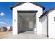 Spacious multi-car garage with modern lighting and design, offering ample space for vehicles and storage at 34449 N Elk Run Rd, San Tan Valley, AZ 85143