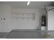 Garage interior with shelving and a water heater at 34449 N Elk Run Rd, San Tan Valley, AZ 85143