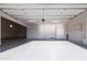 Modern garage with polished floor and bright lighting showcasing its cleanliness and spaciousness at 34449 N Elk Run Rd, San Tan Valley, AZ 85143