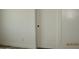 Clean, freshly-painted hallway features a modern trim and a closed, paneled door at 34449 N Elk Run Rd, San Tan Valley, AZ 85143