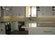 The kitchen features a large center island with counter seating and updated stainless appliances at 34449 N Elk Run Rd, San Tan Valley, AZ 85143