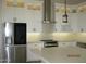 New kitchen featuring white cabinets, stainless appliances, and a center island with seating at 34449 N Elk Run Rd, San Tan Valley, AZ 85143