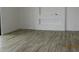 An open-concept living room features wood-look tile floors and recessed wall niches at 34449 N Elk Run Rd, San Tan Valley, AZ 85143