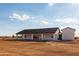 Back of a new home with a covered patio, perfect for enjoying outdoor living against a blue sky at 34449 N Elk Run Rd, San Tan Valley, AZ 85143