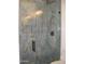 Sleek, modern shower features stylish grey marble-style tiles, matte black hardware, and glass surround at 34449 N Elk Run Rd, San Tan Valley, AZ 85143