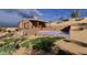 Beautiful backyard featuring a stylish pool and deck, perfectly integrated into the desert landscape at 3545 N Vista Way # 404, Buckeye, AZ 85396