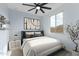 Digitally staged bedroom boasts modern decor, a comfortable bed, and natural light enhancing the inviting space at 3623 S 78Th Dr, Phoenix, AZ 85043