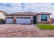 Charming single-story home showcasing a three-car garage and a meticulously paved driveway for added curb appeal at 3623 S 78Th Dr, Phoenix, AZ 85043
