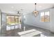 Spacious living room featuring tile floors, recessed lighting, and a view of the backyard at 3623 S 78Th Dr, Phoenix, AZ 85043
