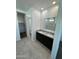 Bathroom with double vanity, granite countertop and walk in shower at 38150 W Bello Ln, Maricopa, AZ 85138