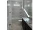 Bathroom featuring a shower-tub combo, granite vanity, and ample lighting at 38150 W Bello Ln, Maricopa, AZ 85138
