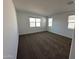 Spacious bedroom featuring carpet flooring and multiple windows at 38150 W Bello Ln, Maricopa, AZ 85138