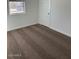 A bedroom with a window, carpet flooring, and white walls at 38150 W Bello Ln, Maricopa, AZ 85138