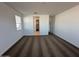 Open bedroom with plush carpeting and lots of natural light from windows at 38150 W Bello Ln, Maricopa, AZ 85138