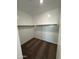 Interior view of a walk-in closet with carpeted flooring and shelves at 38150 W Bello Ln, Maricopa, AZ 85138