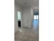 Bright hallway with tile flooring leading to various rooms in the house at 38150 W Bello Ln, Maricopa, AZ 85138