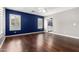 Lovely bedroom features hardwood floors, plantation shutters, and an ensuite bathroom at 3913 E Derringer Way, Gilbert, AZ 85297