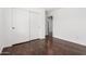 Bedroom featuring hardwood floors, a ceiling fan, and closet with sliding doors at 3913 E Derringer Way, Gilbert, AZ 85297