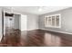 Spacious bedroom with wood floors, a ceiling fan, and a walk-in closet at 3913 E Derringer Way, Gilbert, AZ 85297