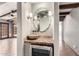 Entertainer's hallway featuring custom lighting, beams, and a convenient wine refrigerator at 3913 E Derringer Way, Gilbert, AZ 85297