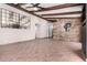 Open living area with tile flooring, a stone accent wall, arched doorways, and an ornate mirror at 3913 E Derringer Way, Gilbert, AZ 85297