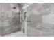 Custom shower features modern tile, a rainfall showerhead, and built in shelving at 3913 E Derringer Way, Gilbert, AZ 85297