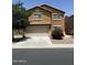 Two-story home featuring an attached two-car garage and low maintenance landscaping at 40246 W Hopper Dr, Maricopa, AZ 85138