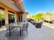 Stylish patio with seating and dining areas, perfect for outdoor entertaining with a serene atmosphere and inviting layout at 42023 N Bridlewood Way, Anthem, AZ 85086