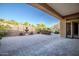 Paver patio in backyard includes seating and landscaping, as well as a decorative fountain at 42023 N Bridlewood Way, Anthem, AZ 85086