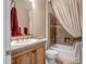 Cozy bathroom featuring a single-sink vanity with wood cabinetry and a combination shower-tub at 42023 N Bridlewood Way, Anthem, AZ 85086