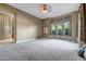 Expansive bedroom featuring neutral carpet, decorative window treatments and ample space for relaxation at 42023 N Bridlewood Way, Anthem, AZ 85086