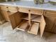 Close up of custom wood cabinetry with drawers, shelves, and brass hardware at 42023 N Bridlewood Way, Anthem, AZ 85086
