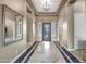 Elegant entryway with tile flooring, an open door to the outside, and views into adjacent rooms at 42023 N Bridlewood Way, Anthem, AZ 85086