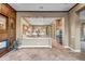 Open-concept kitchen with stone floors, island, and stainless steel appliances, ideal for entertaining at 42023 N Bridlewood Way, Anthem, AZ 85086