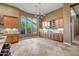 Spacious kitchen with ample wooden cabinetry, marble countertops, and large windows offering outdoor views at 42023 N Bridlewood Way, Anthem, AZ 85086